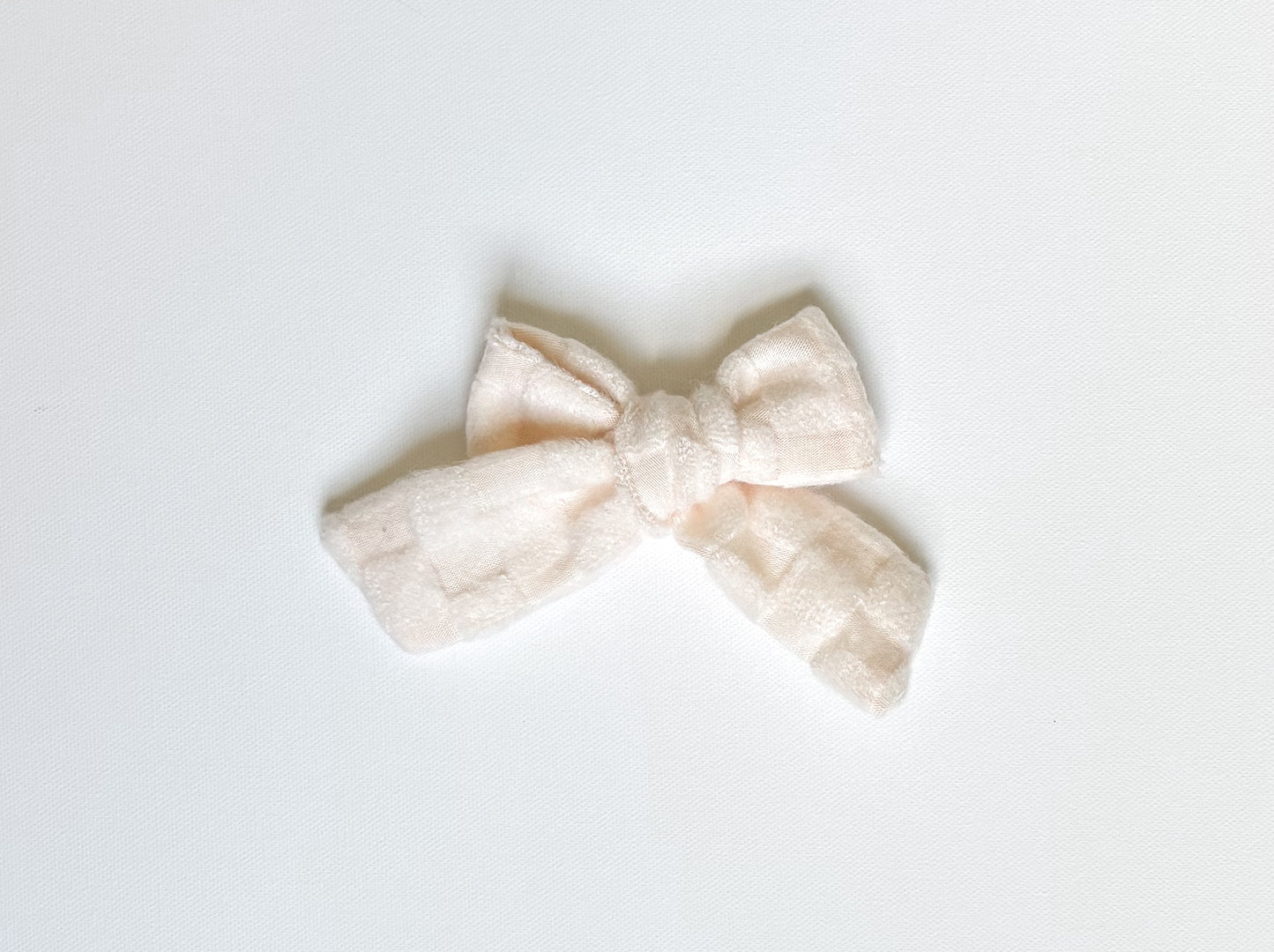 Ivory cozy checks bow clip