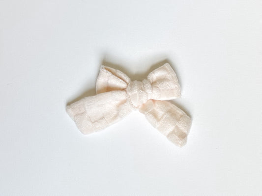 Ivory cozy checks bow clip